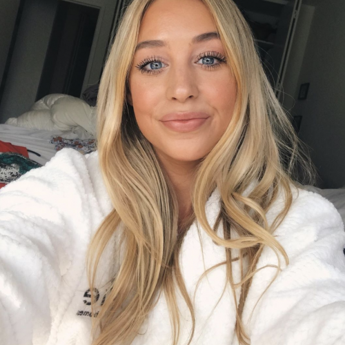 blonde in robe getting ready for the day