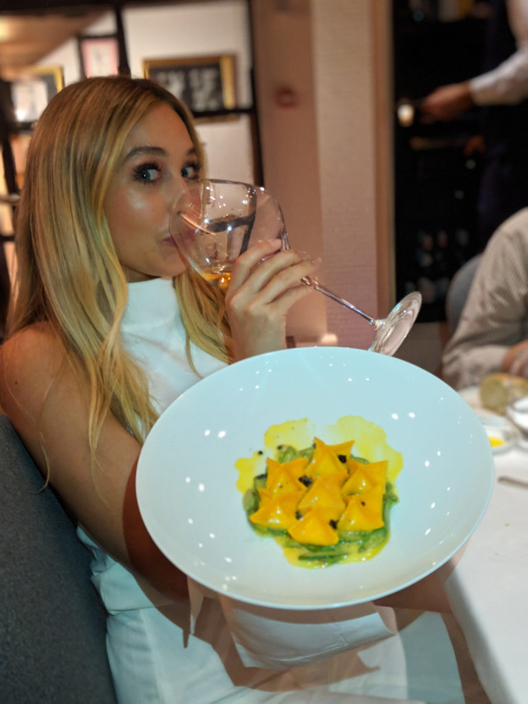 girl with a plate of pasta at Borgo san jacobo
