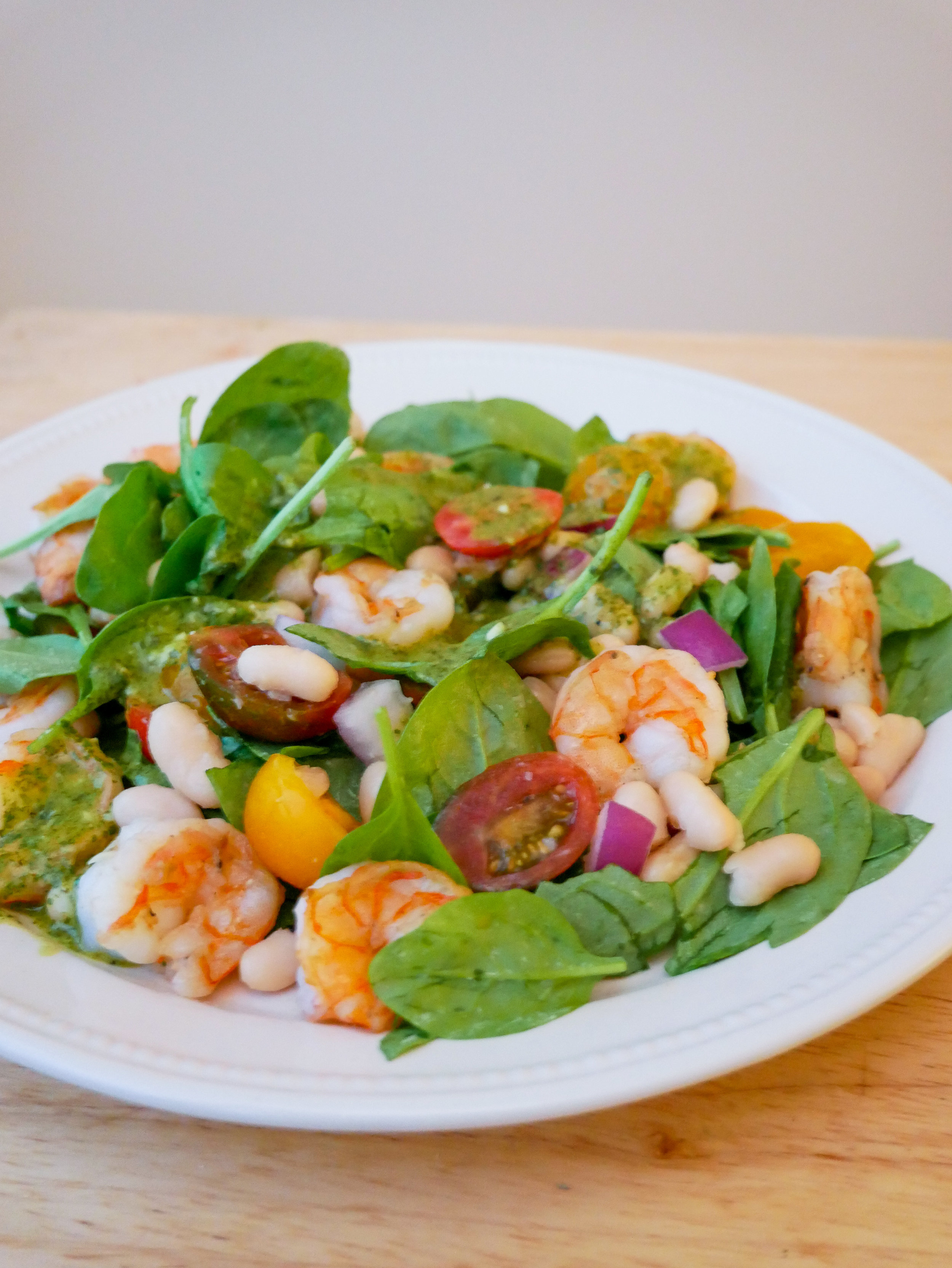 Spinach salad with shrimp, cannellini beans and a cilantro garlic lime vinaigrette