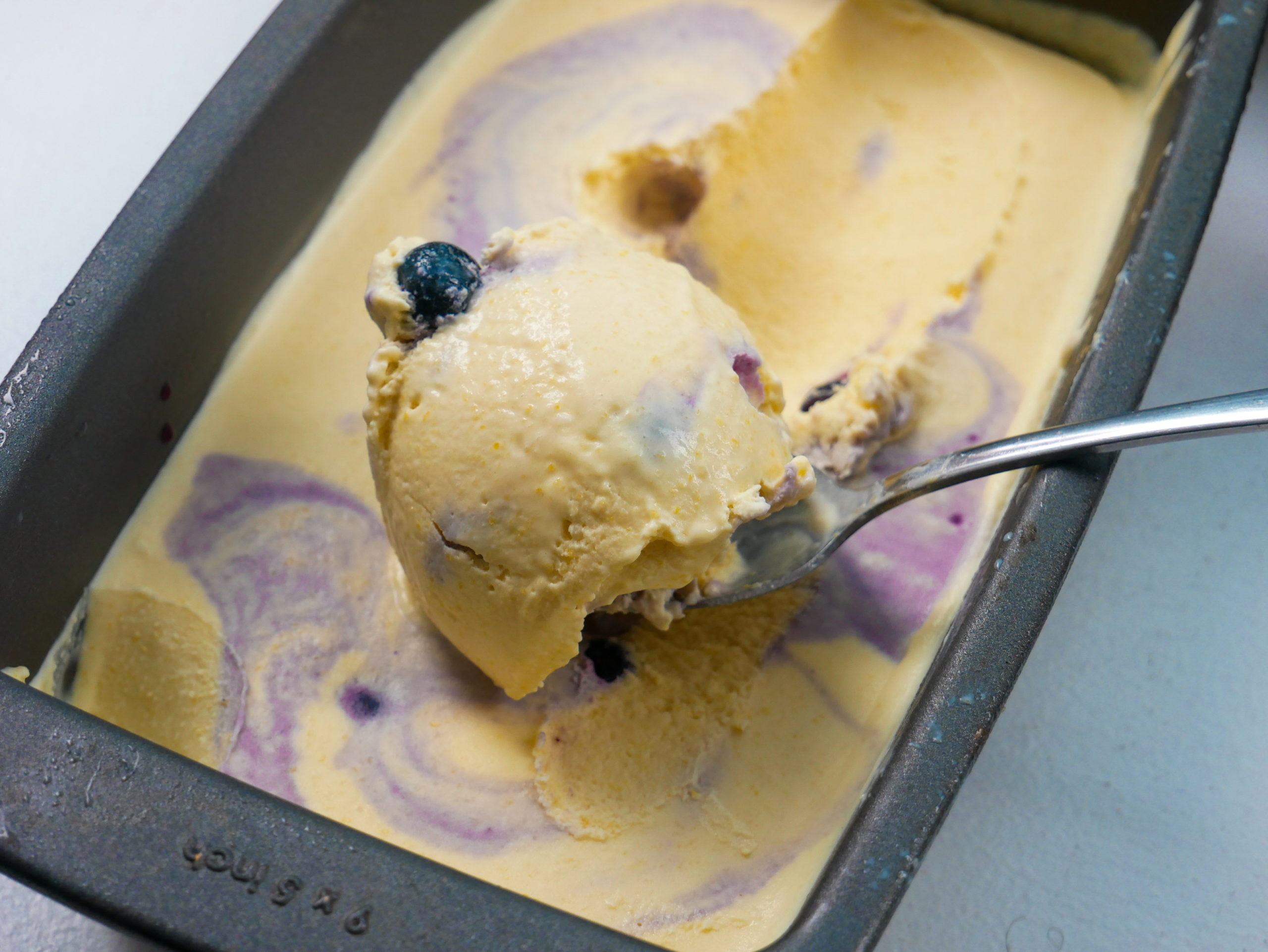 no churn sweet corn ice cream with blueberry compote swirls