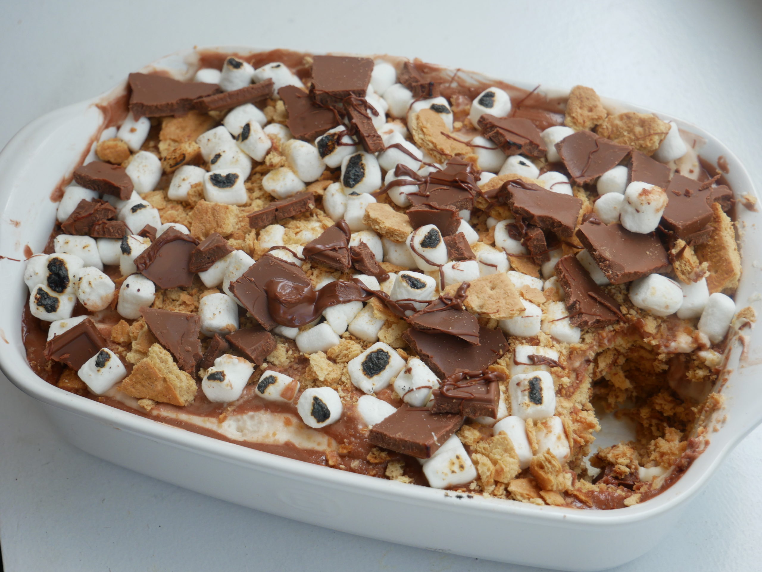 smores icebox cake with toasted marshmallows and nutella drizzle