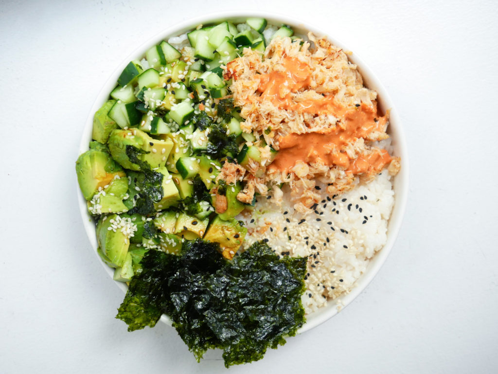 California roll poke bowl with avocado, cucumber, spicy mayo and seaweed