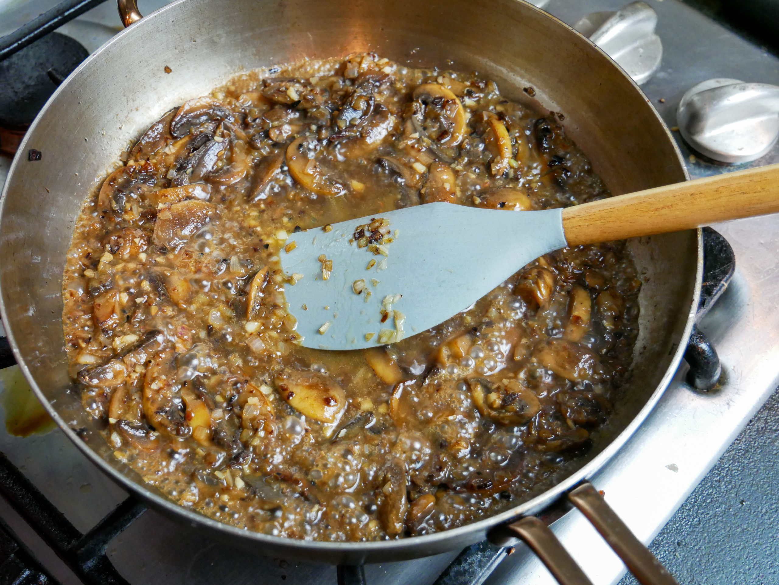 mushrooms shallots garlic white wine in a skillet sauce