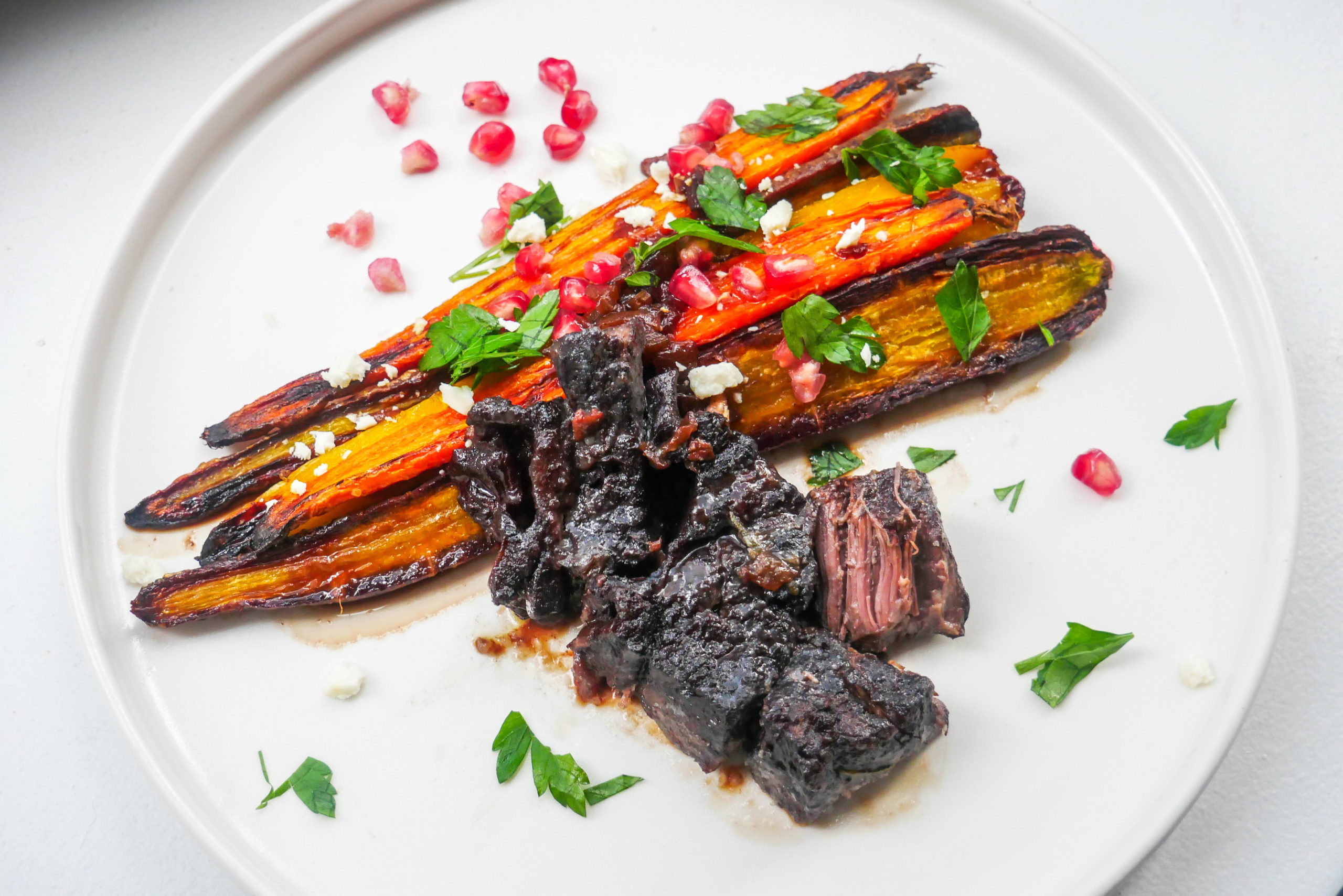 Red Wine Pomegranate Braised Short Ribs with Rainbow Carrots