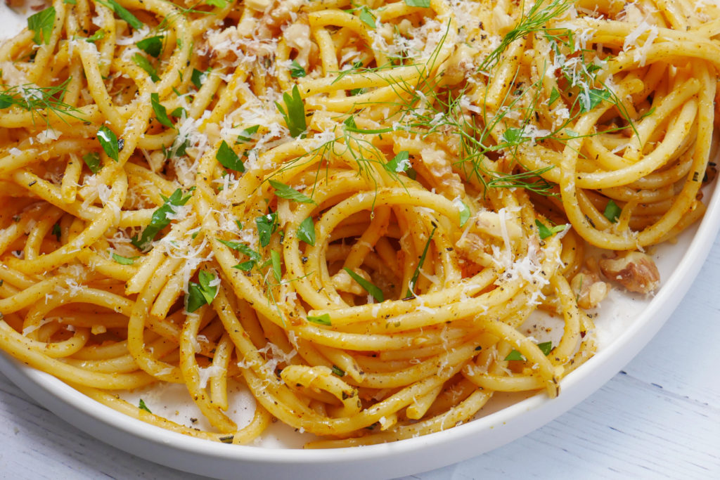 pumpkin butter pasta with parmesan cheese, fennel, parsley, walnuts