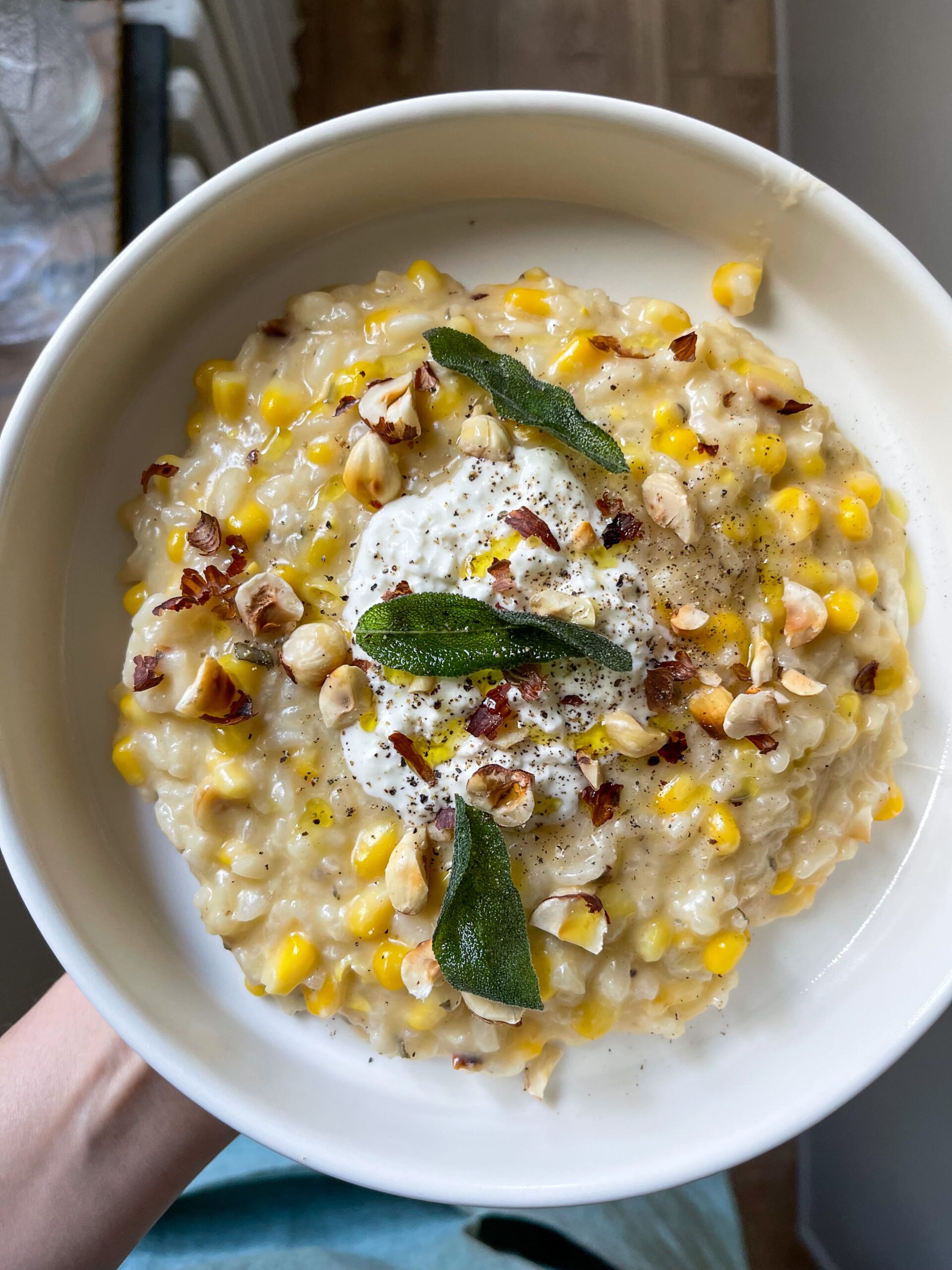 sweet corn risotto with burrata and hazelnuts