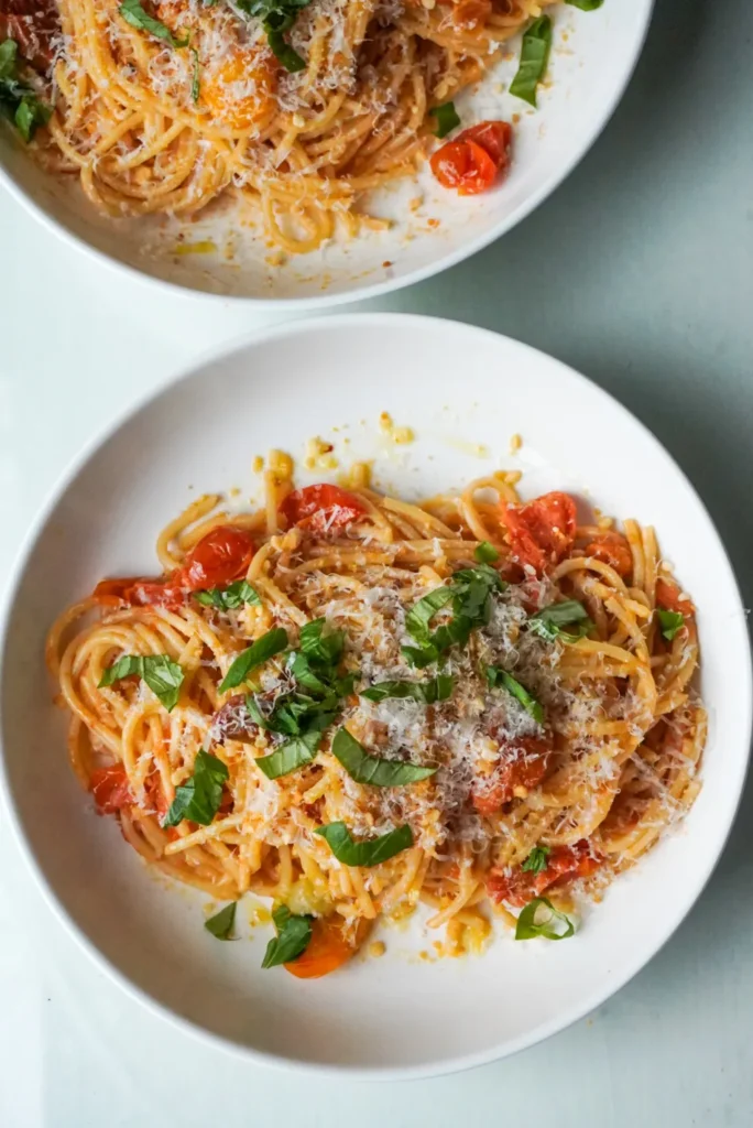 Easy summer pasta recipe with bucatini noodles, tomato butter, and crunchy lemon zest breadcrumbs