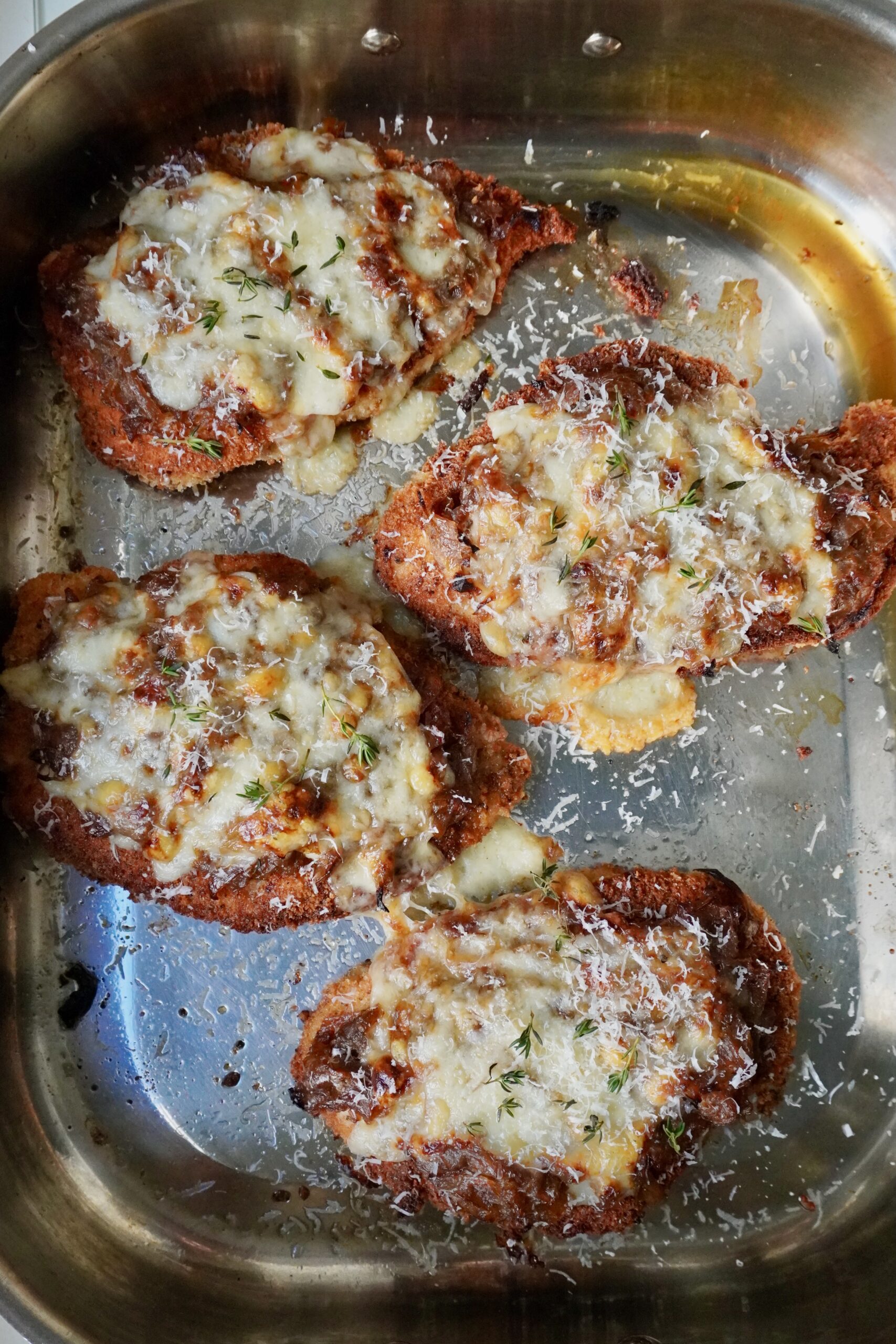 French onion chicken cutlets with bubbling Gruyère fresh from the oven