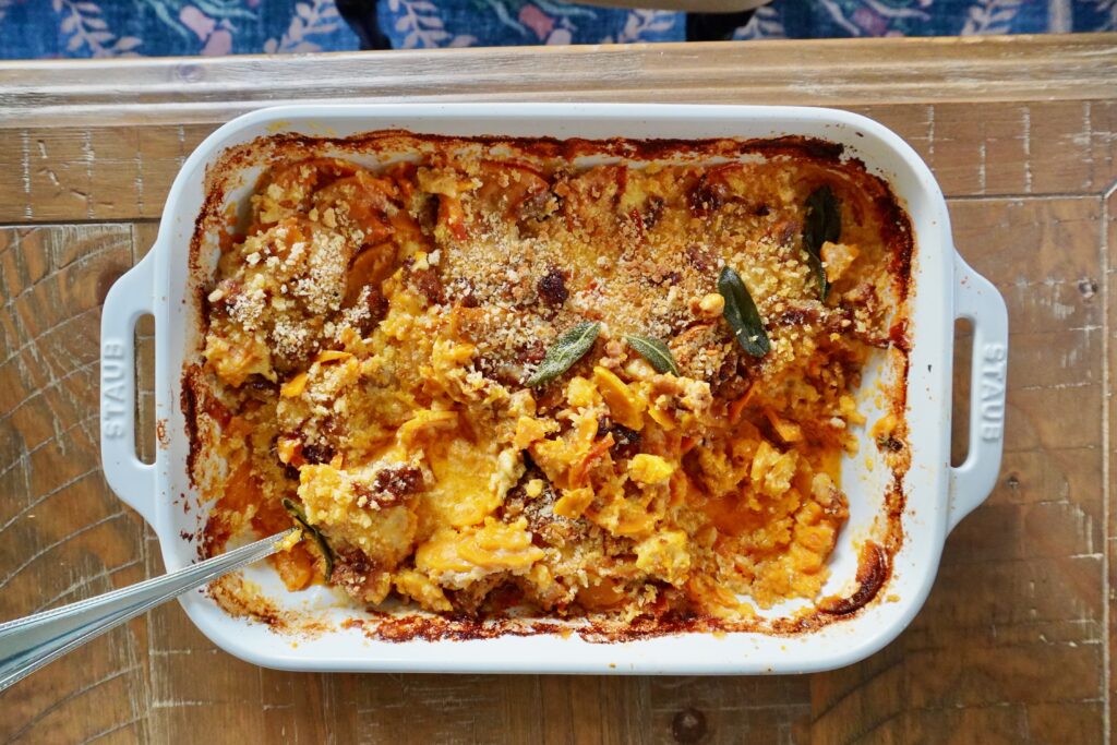 Honeynut squash and sausage gratin topped with crispy sage.