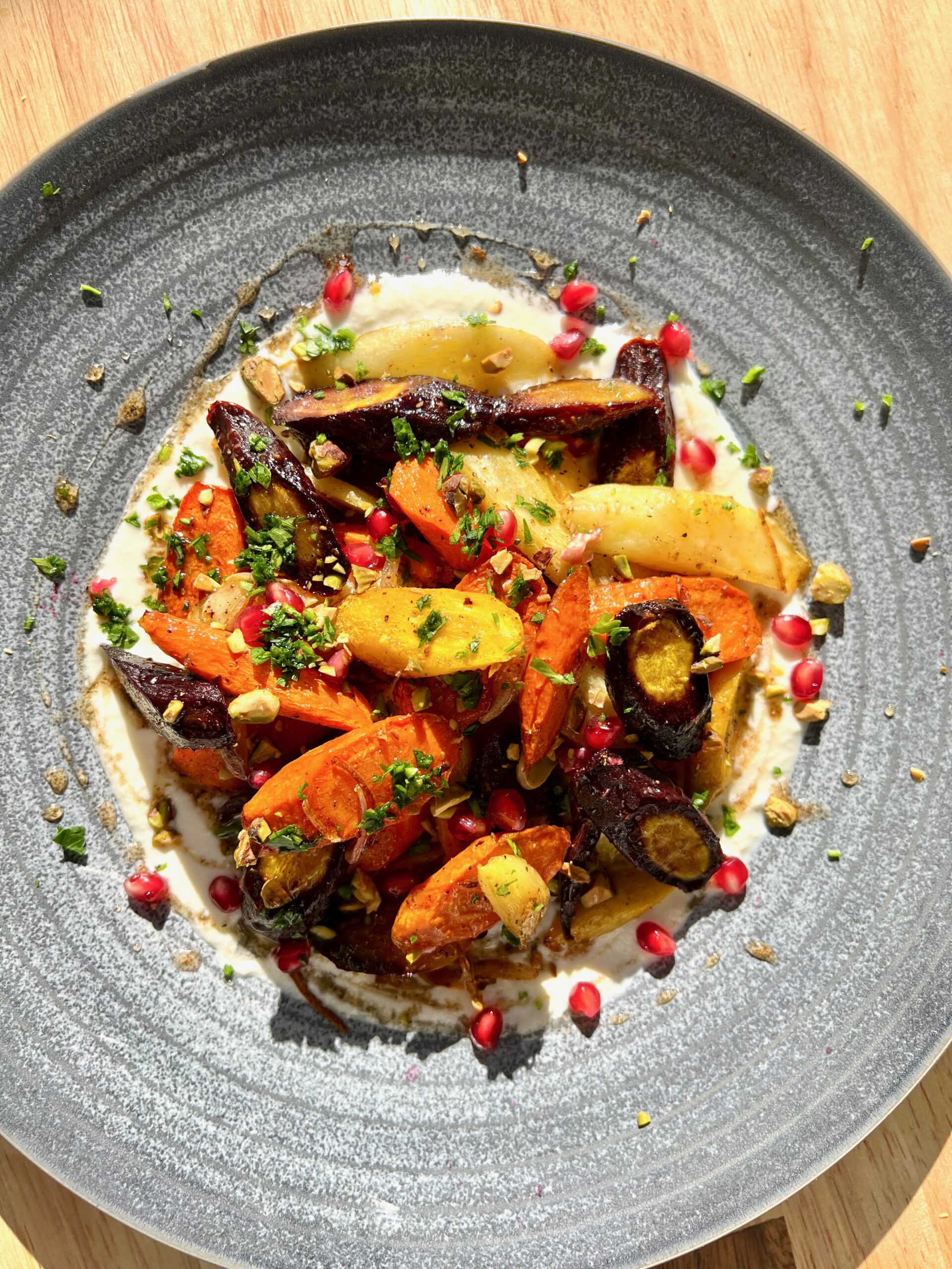 rainbow carrots with whipped feta, pomegranate, parsley and harissa honey