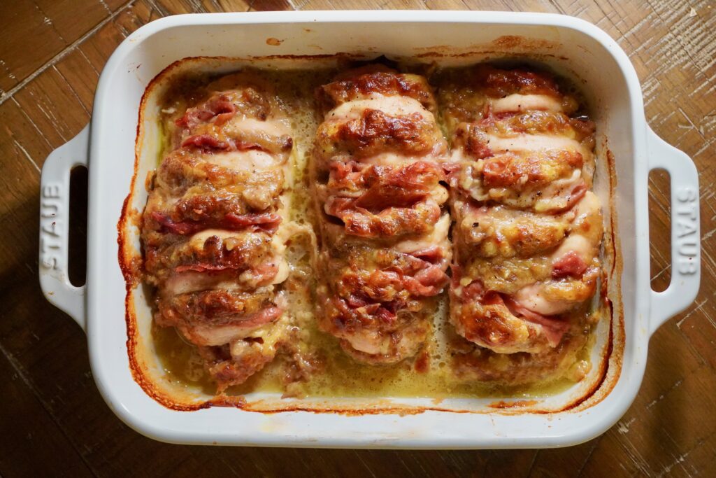 Hasselback chicken stuffed with brie, chestnuts, and prosciutto fresh from the oven