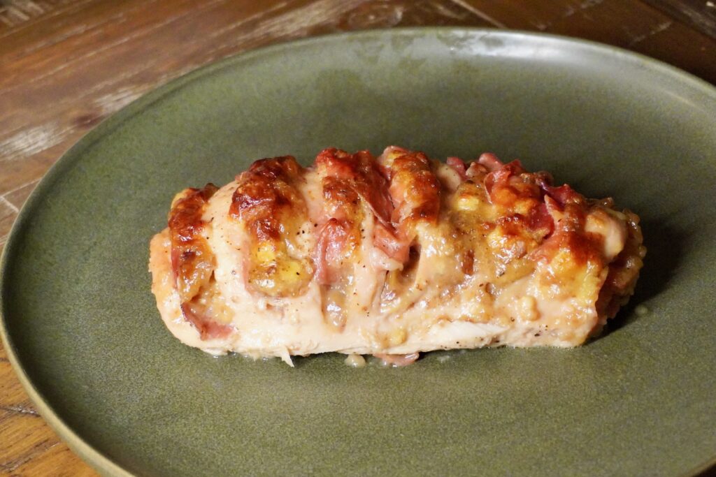 Golden baked Hasselback chicken side profile