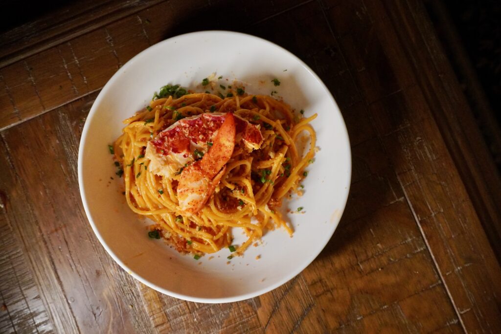 Lobster spaghetti with brown butter chive crunch and poached lobster tail