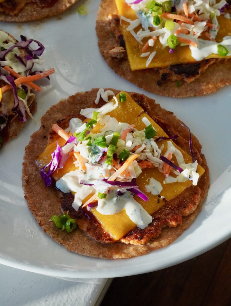 smash taco with high protein ranch dressing drizzled on top
