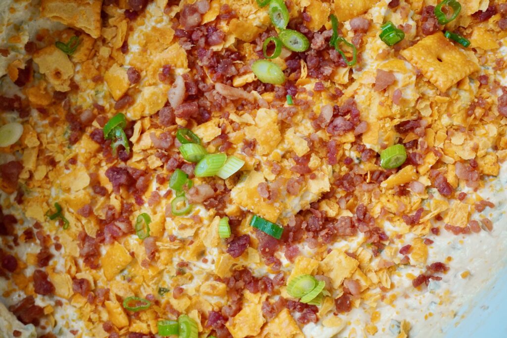 crockpot jalapeno popper chicken dip with cheez its and scallions 