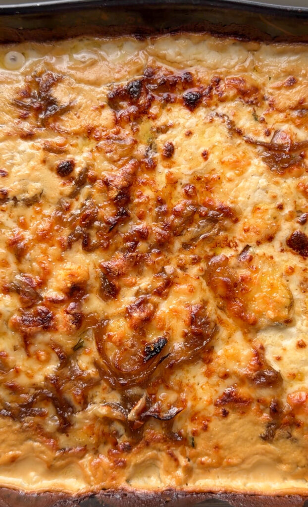 Golden baked French onion potato casserole in a large baking dish