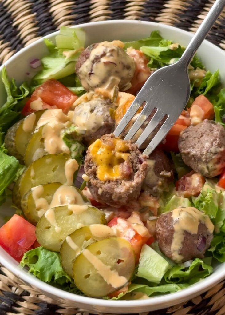 Big Mac meatball bowl with romaine lettuce, pickles, and burger sauce drizzle
