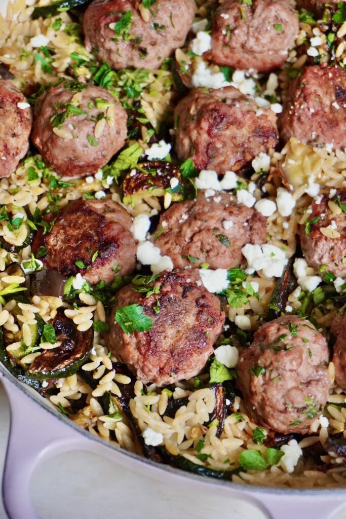 Colorful vegetables, juicy lamb, bright citrusy pasta, and pockets of creamy feta in every bite.