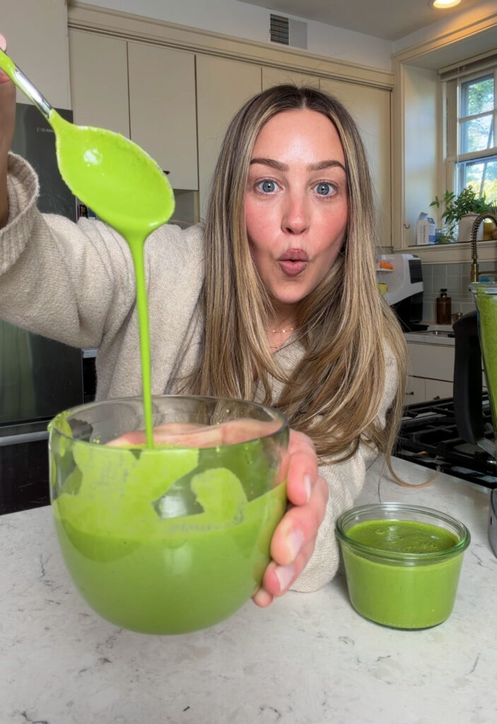 Close-up of silky green goddess dressing with olive oil sheen