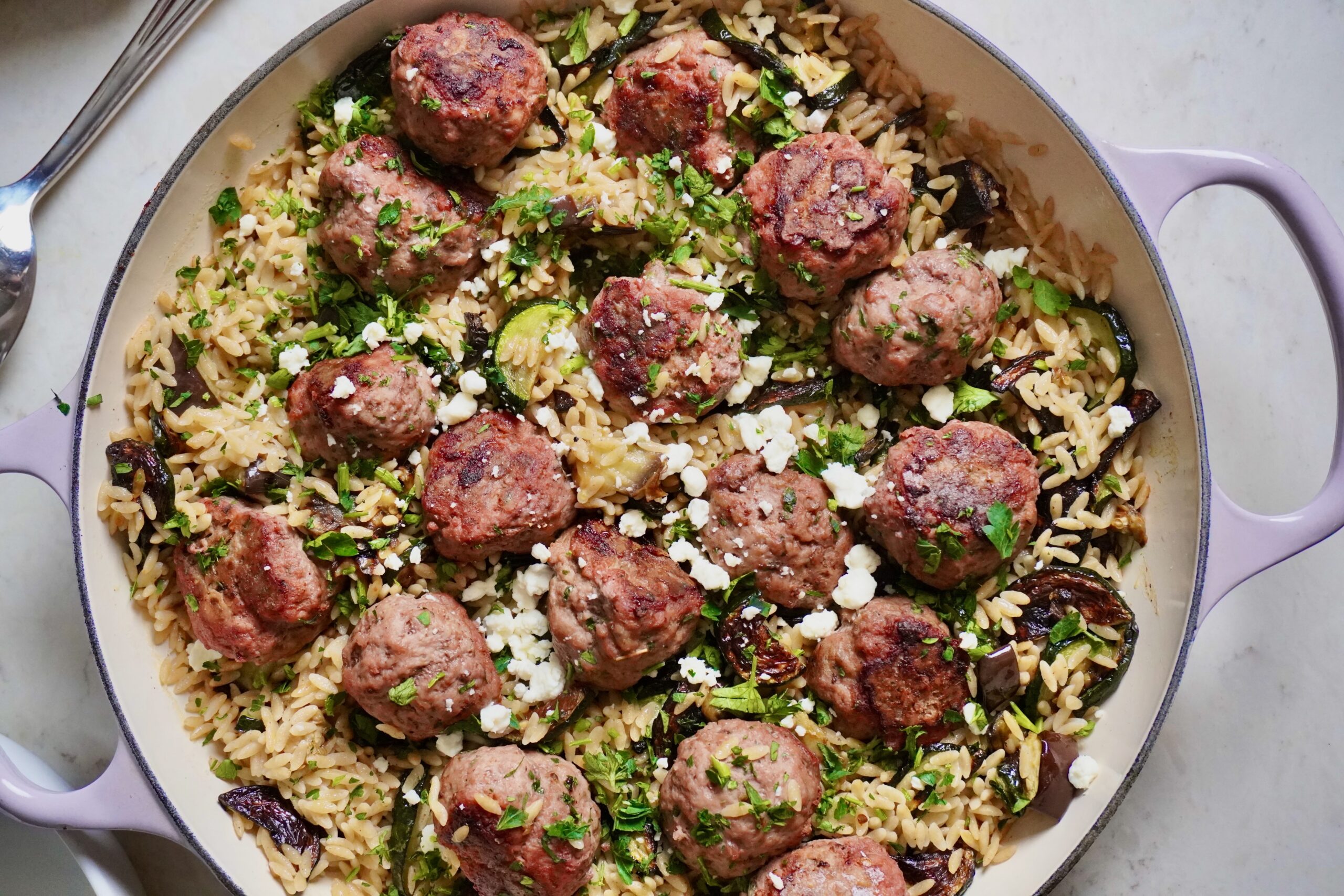 serve these sheet pan meatballs with orzo and roasted veggies for a complete dinner