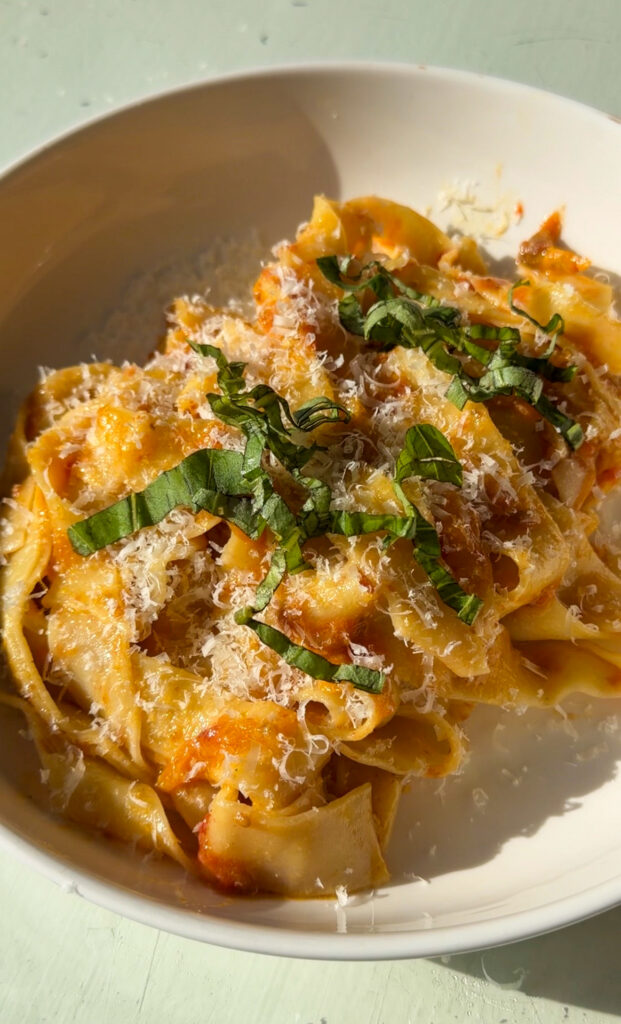 close-up of slow-roasted cherry tomato and garlic confit pasta