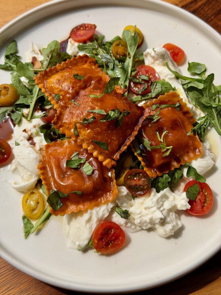 roasted ravioli with burrata and tomatoes