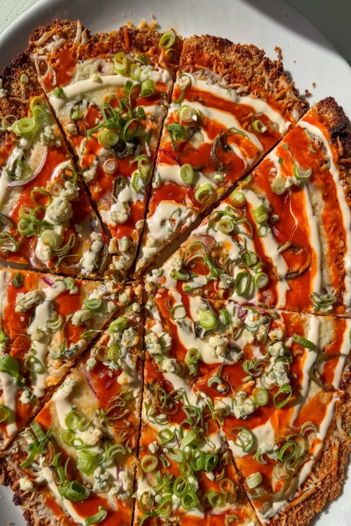 buffalo chicken cutlet cut into pizza slices