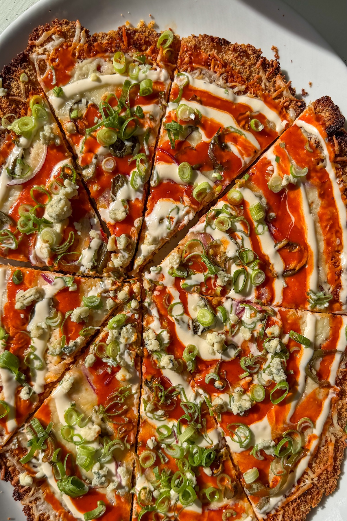 buffalo chicken cutlet cut into pizza slices